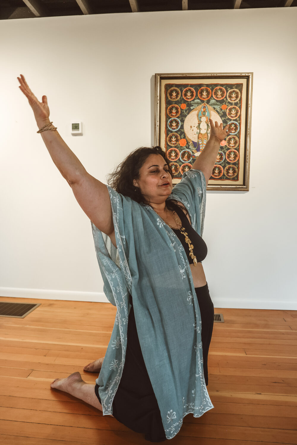 Monica in flowing movement, arms raised