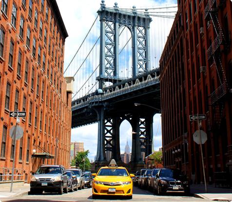 New York taxi and bridge in background