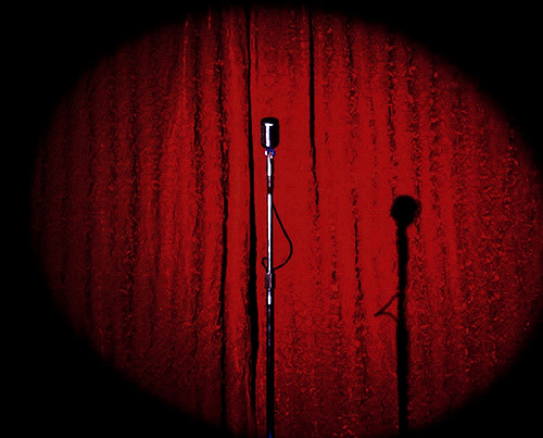 Stage with red curtain and microphone image